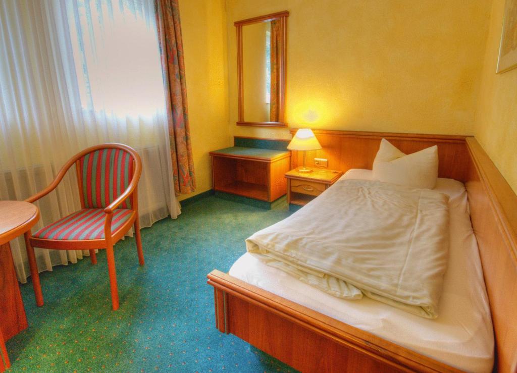 Postel nebo postele na pokoji v ubytování Meister BÄR HOTEL Vogtland