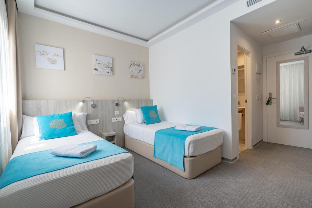 Postel nebo postele na pokoji v ubytování Hotel Soul de Javea