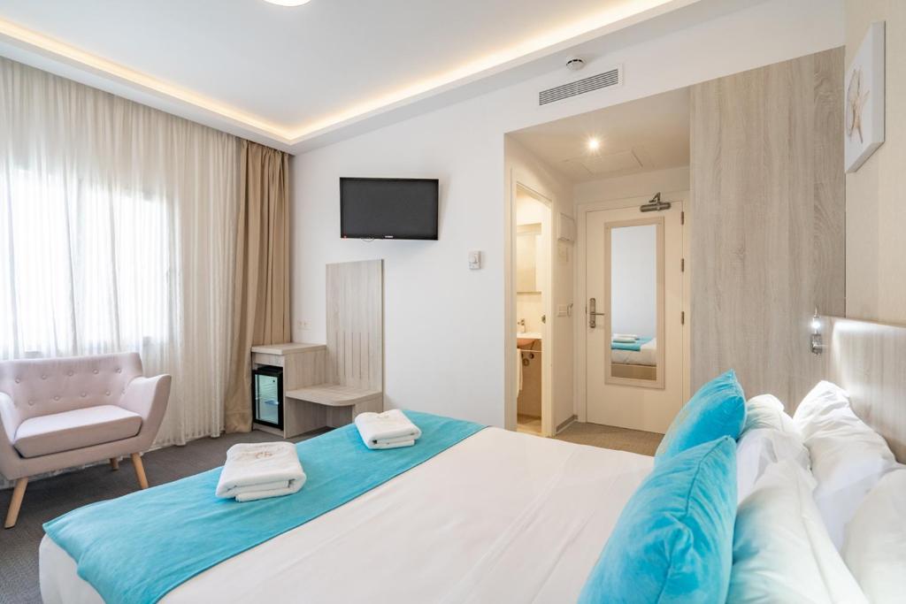 Postel nebo postele na pokoji v ubytování Hotel Soul de Javea