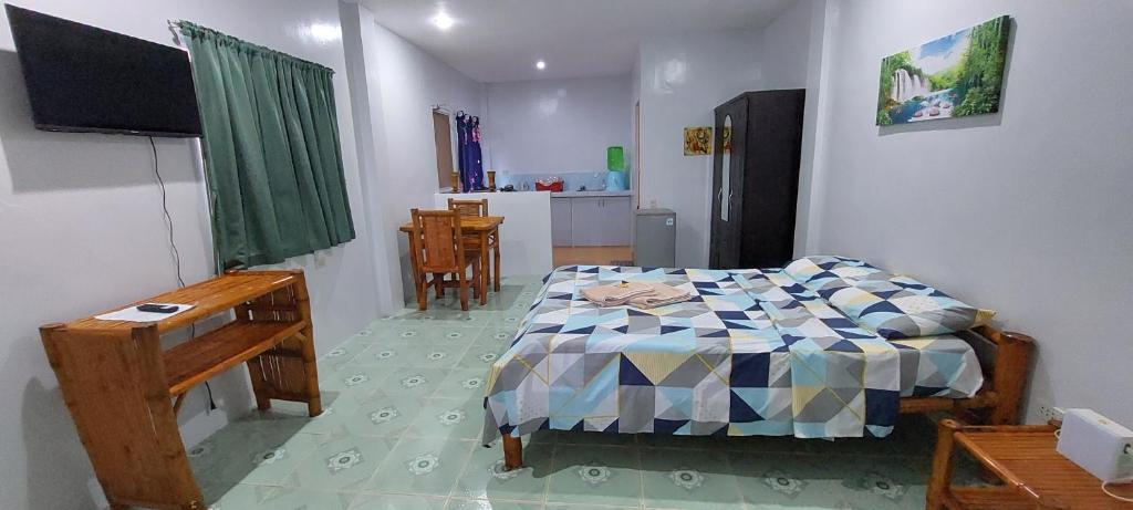 Postel nebo postele na pokoji v ubytování Genna's Tourist Inn Santa Fe