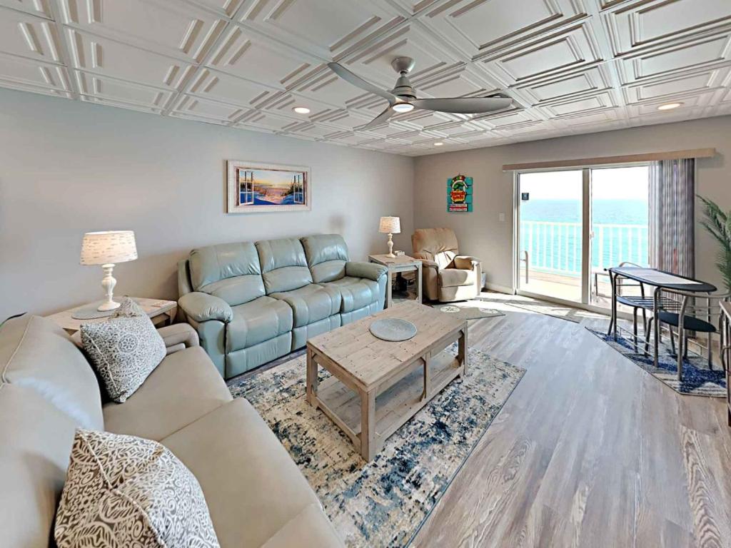 a living room with a couch and a table at Sans Souci #605 in Pensacola Beach