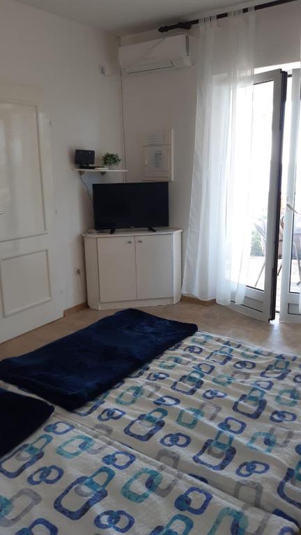 Postel nebo postele na pokoji v ubytování Apartmani Milosevic