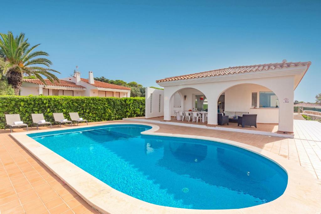 a swimming pool in the backyard of a villa at Binicasal in Sant Lluis