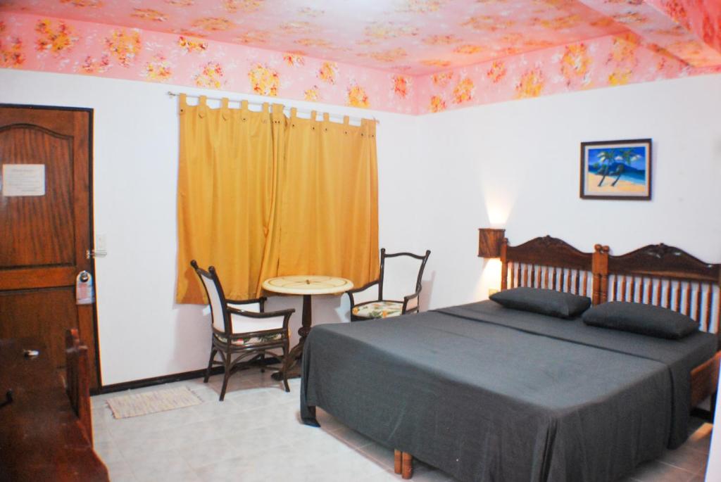 Postel nebo postele na pokoji v ubytování Blue Coral Resort Boracay