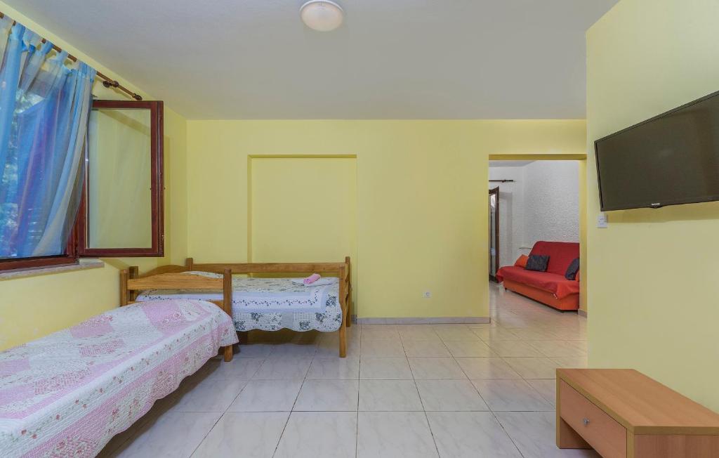 Postel nebo postele na pokoji v ubytování Apartments Nusha