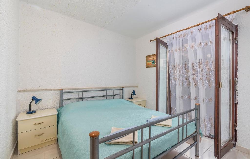 Postel nebo postele na pokoji v ubytování Apartments Nusha