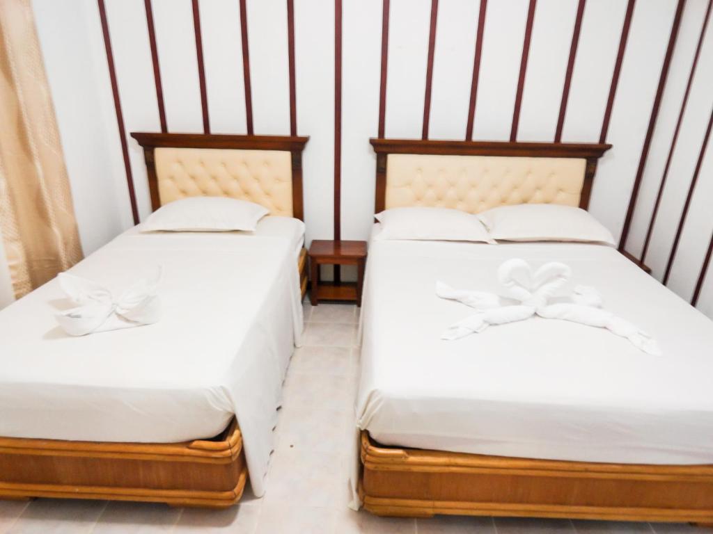 Postel nebo postele na pokoji v ubytování Blue Coral Resort Boracay