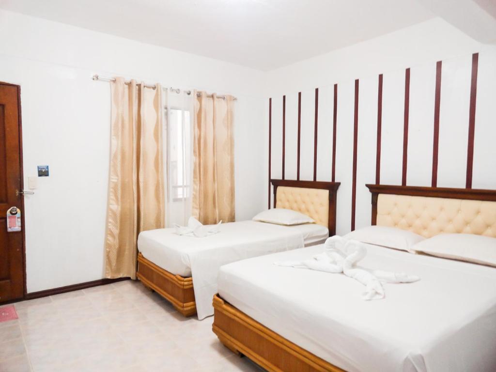 Postel nebo postele na pokoji v ubytování Blue Coral Resort Boracay