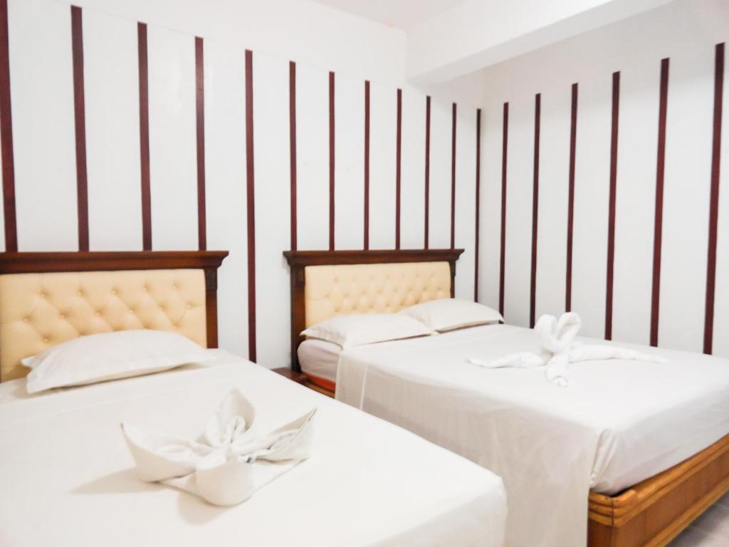 Postel nebo postele na pokoji v ubytování Blue Coral Resort Boracay