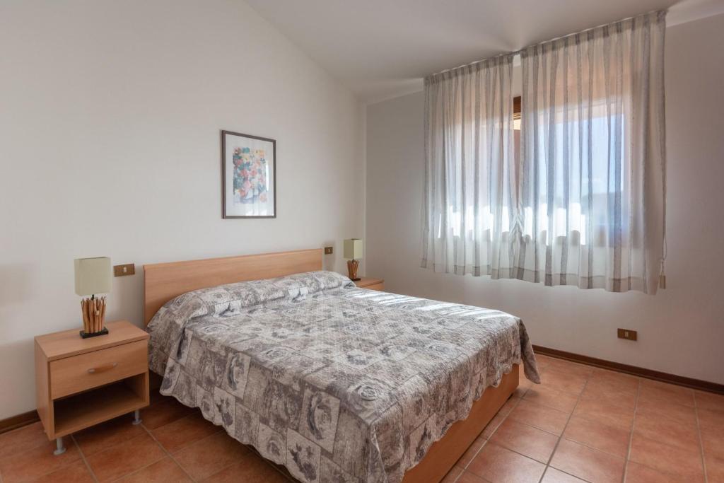 Postel nebo postele na pokoji v ubytování Residence Albarella