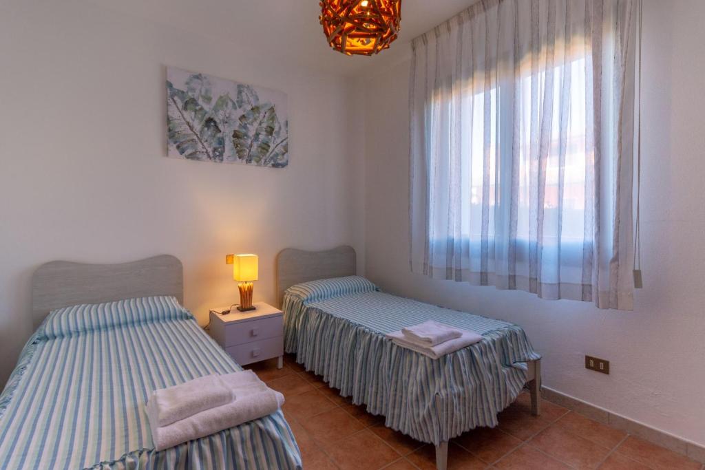 Postel nebo postele na pokoji v ubytování Residence Albarella