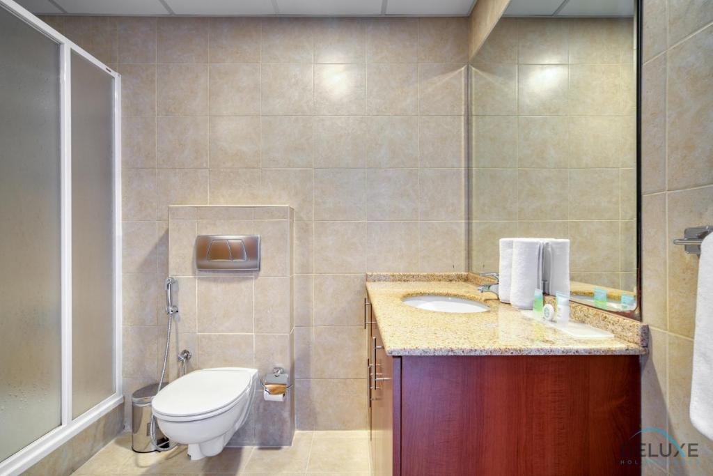 Koupelna v ubytování Opulent 1BR at MAG 218 Dubai Marina by Deluxe Holiday Homes