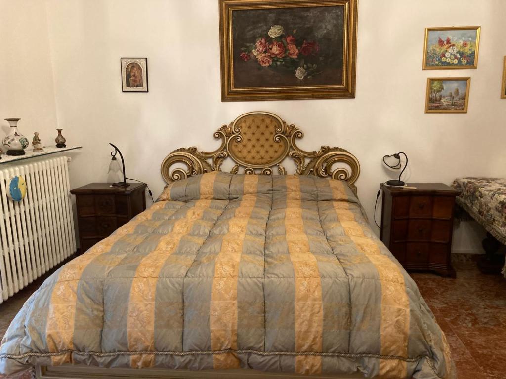 a bedroom with a bed and two night stands at Casa Vacanza a Limbiate in Limbiate