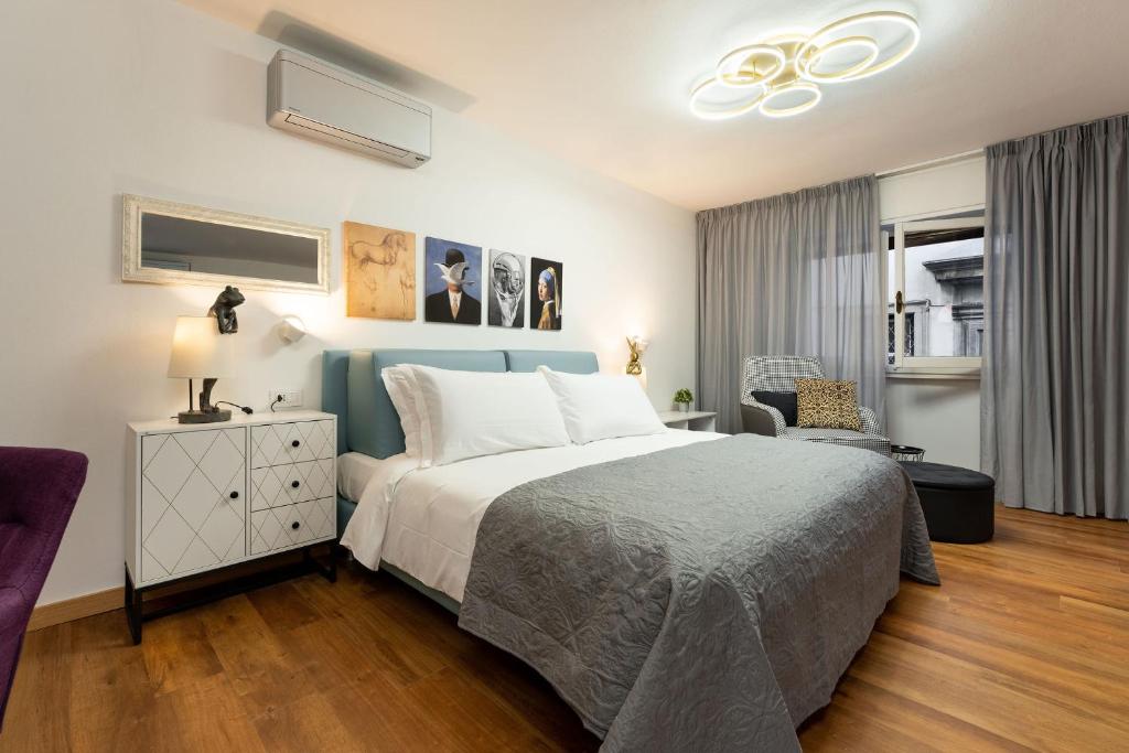 Łóżko lub łóżka w pokoju w obiekcie Guicciardini Apartment