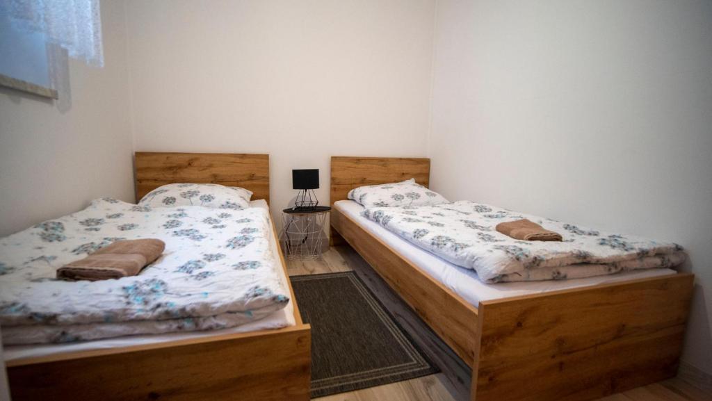 Postel nebo postele na pokoji v ubytování U Jędrusia