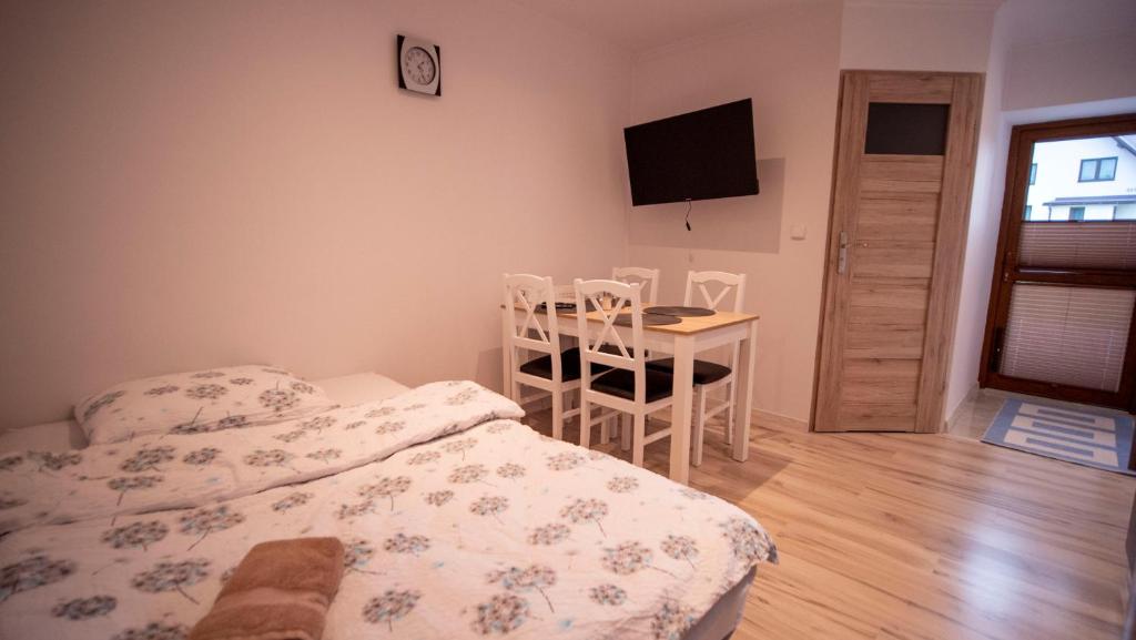 Postel nebo postele na pokoji v ubytování U Jędrusia