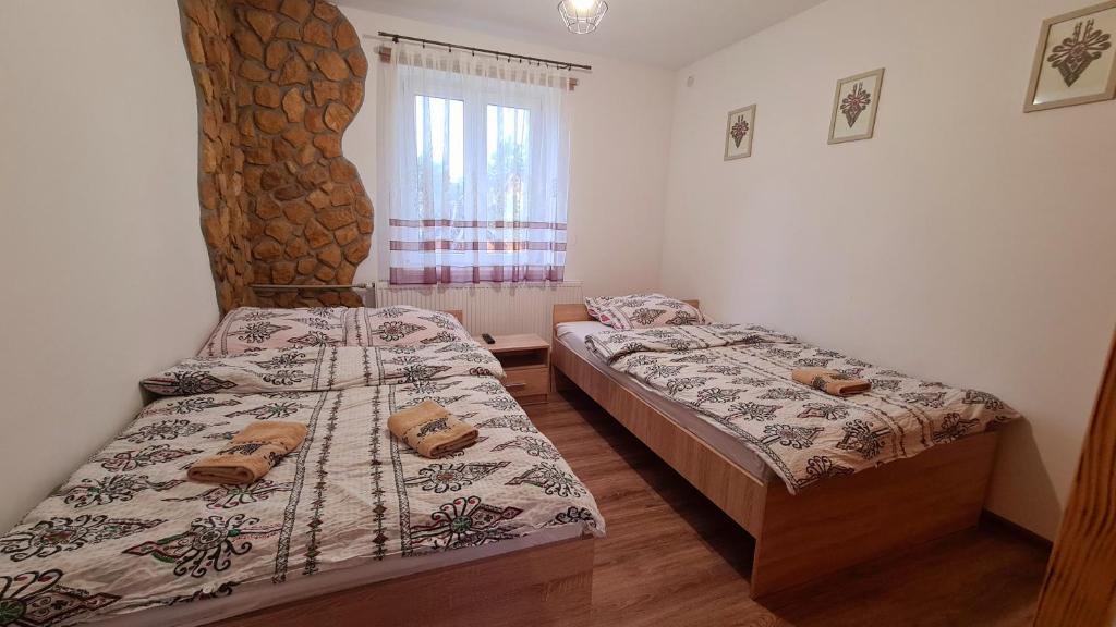 Postel nebo postele na pokoji v ubytování U Jędrusia