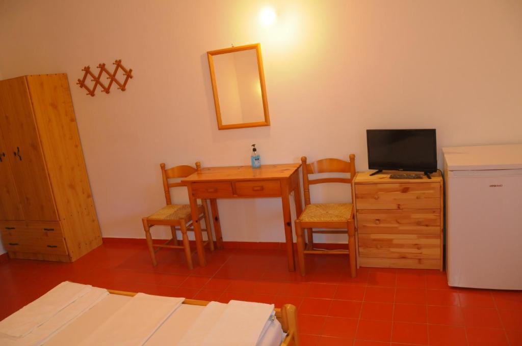 Postel nebo postele na pokoji v ubytování Chalikias Rooms