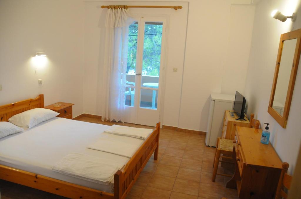 Postel nebo postele na pokoji v ubytování Chalikias Rooms