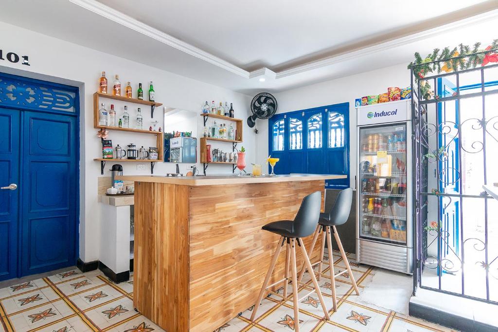 Kuchyň nebo kuchyňský kout v ubytování Casa Flor Hostel & Drinks