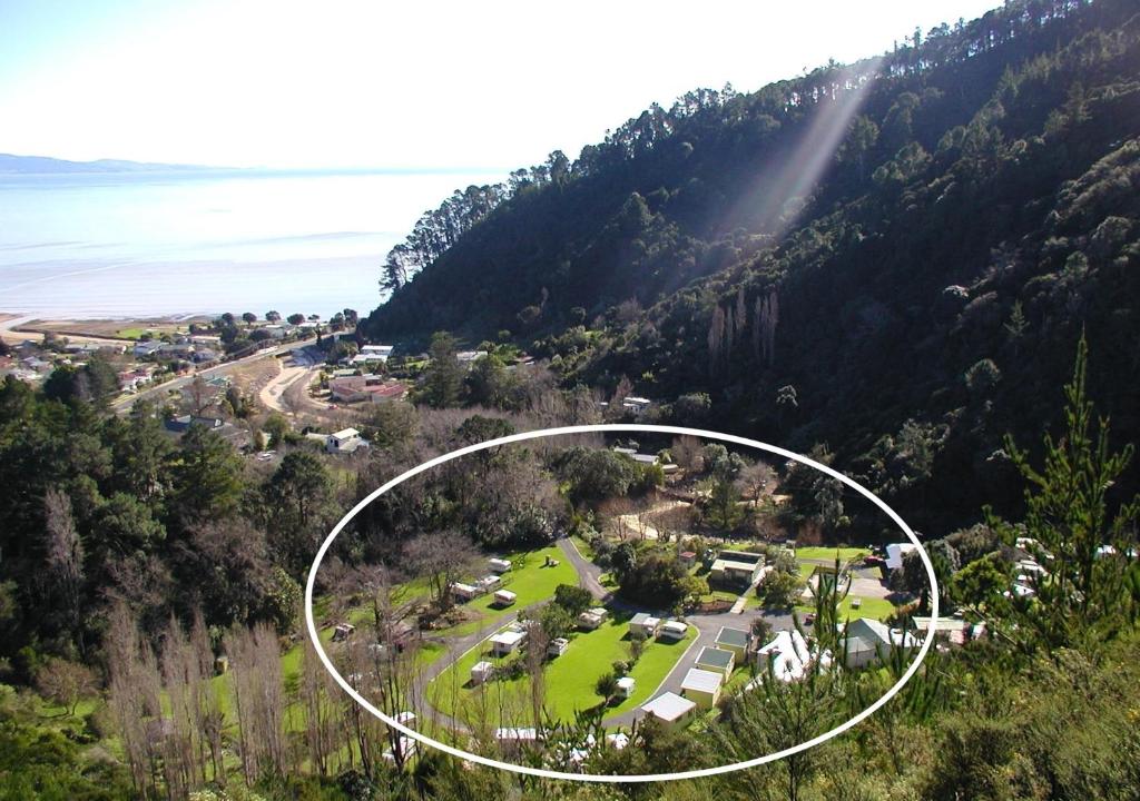 an aerial view of a house on a mountain at Dickson Holiday Park in Thames