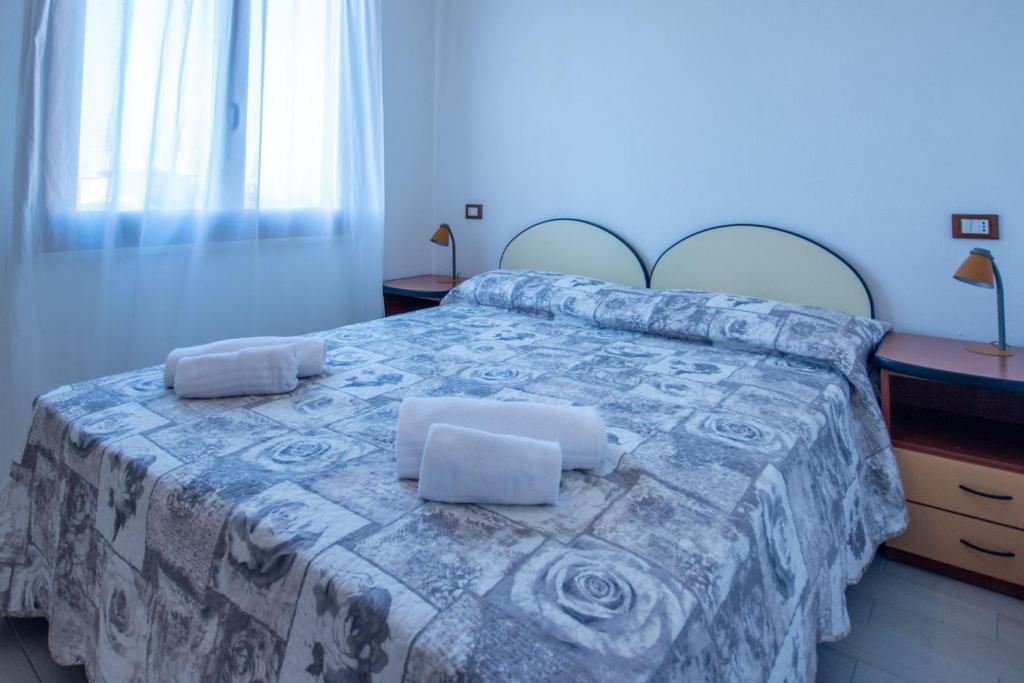Postel nebo postele na pokoji v ubytování Residence Albarella