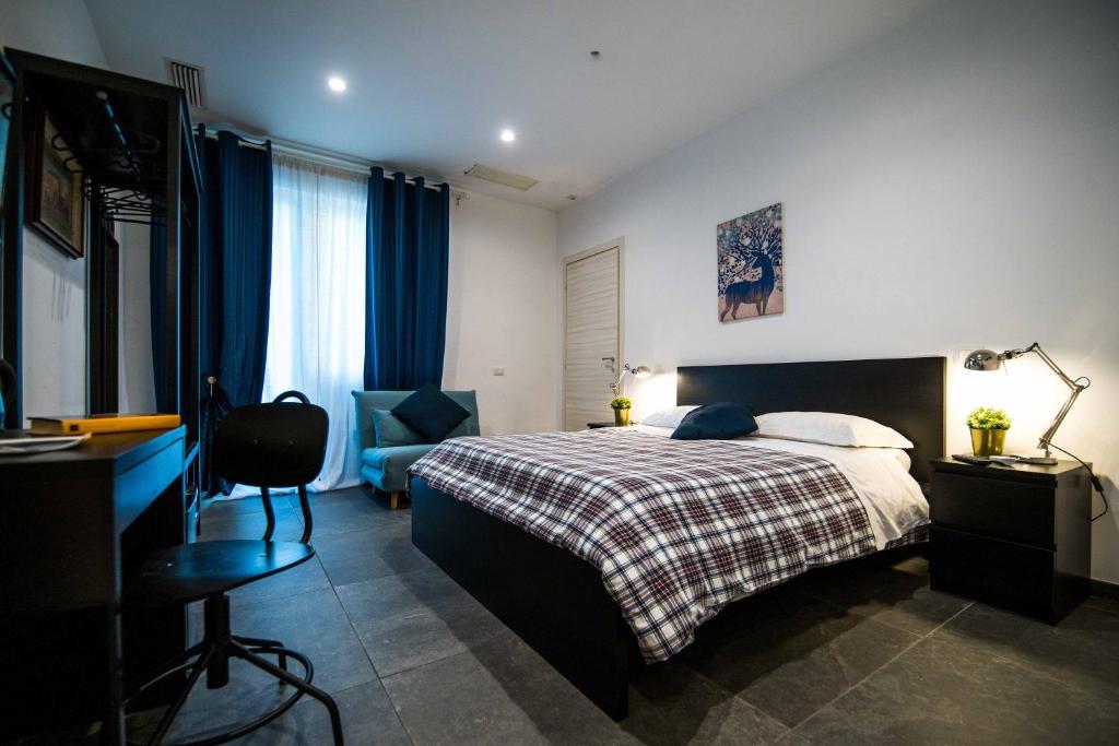 A bed or beds in a room at Quattro Briganti