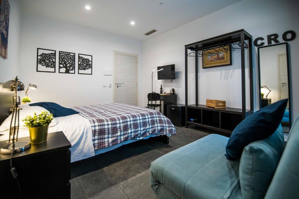 A bed or beds in a room at Quattro Briganti