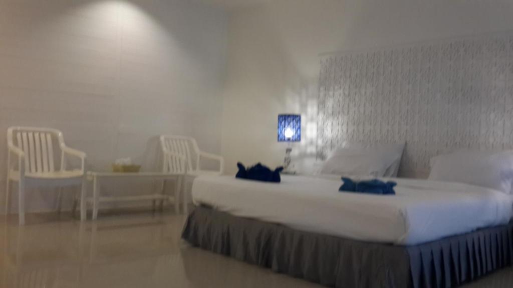 Postel nebo postele na pokoji v ubytování PP Blue Sky Resort-SHA Plus