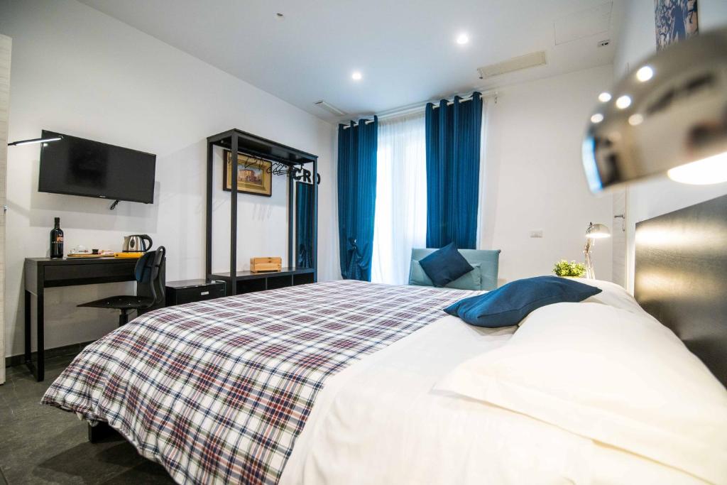 A bed or beds in a room at Quattro Briganti
