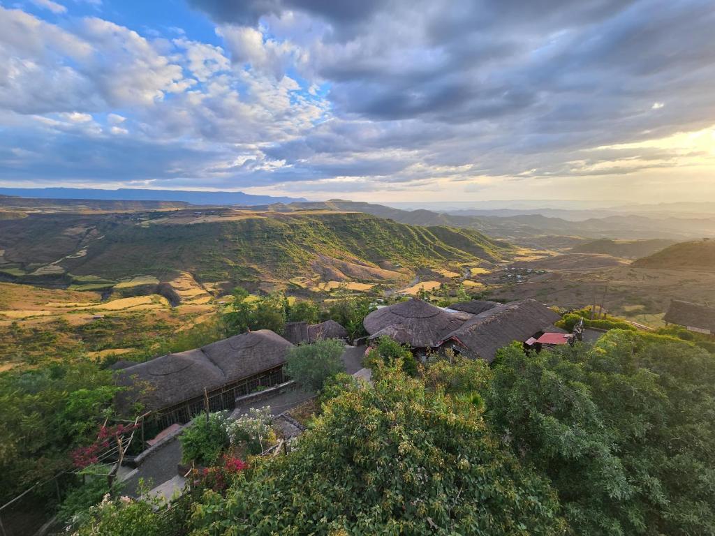 an aerial view of a village in the hills at Sora Lodge Lalibela in Lalībela