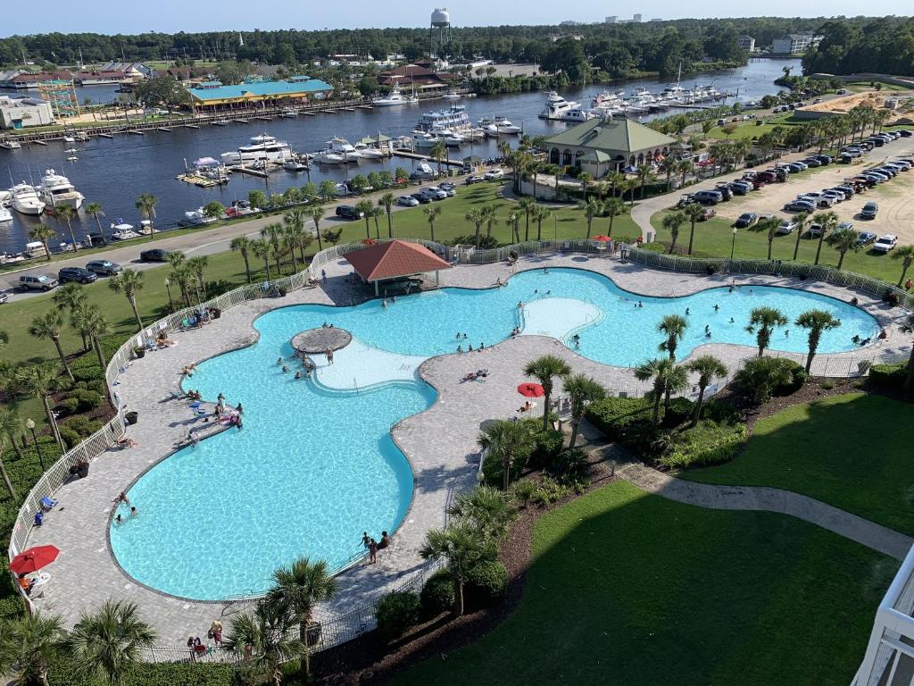 an aerial view of a pool at a resort at Yacht Club Villas #2-405 condo in Myrtle Beach