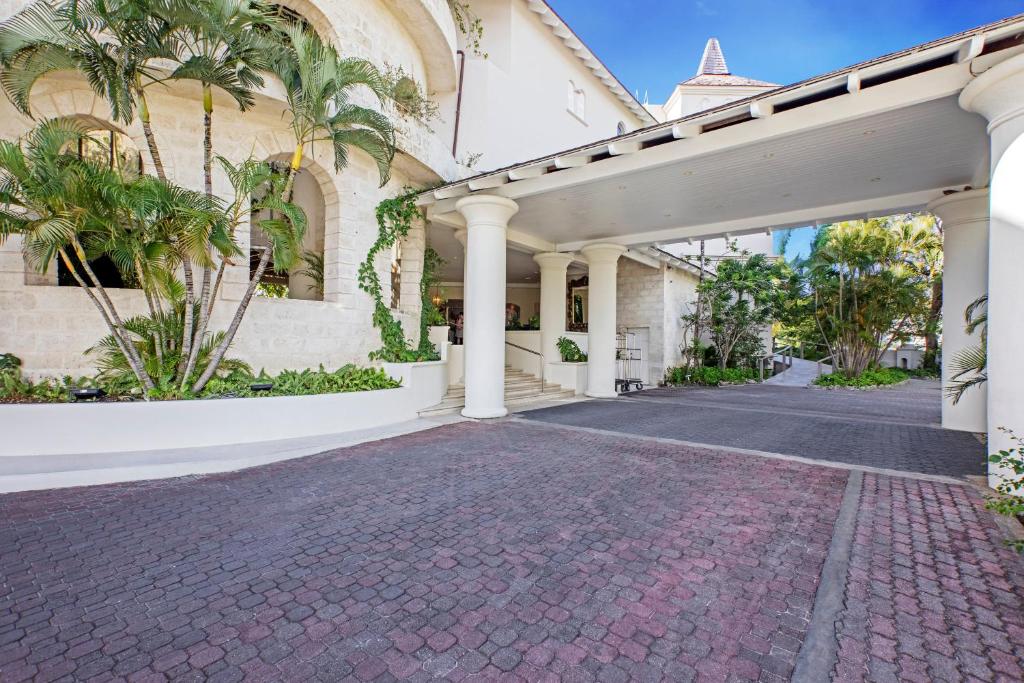 an empty driveway in front of a building at Bougainvillea Barbados in Christ Church
