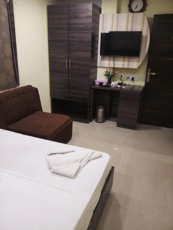 TV a/nebo společenská místnost v ubytování Hotel Rayan Inn