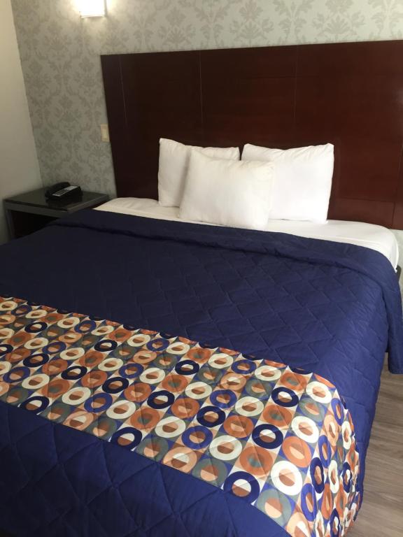 Postel nebo postele na pokoji v ubytování Atlantic Motor Inn