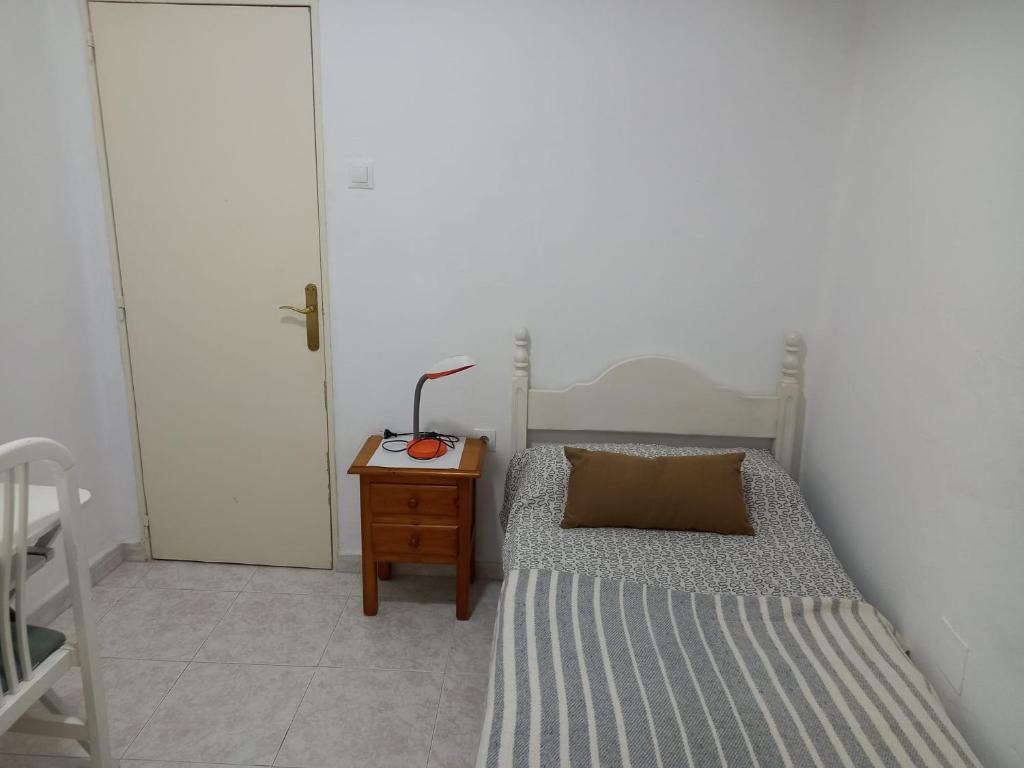 Łóżko lub łóżka w pokoju w obiekcie Centric apartment in Malaga