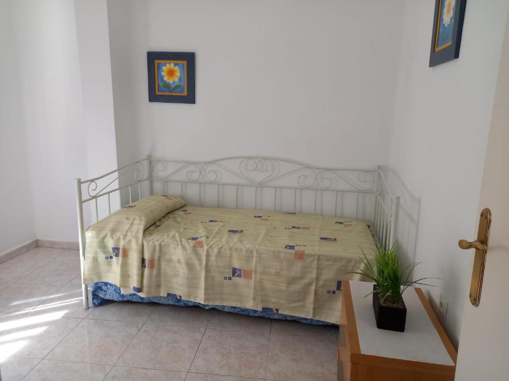 Łóżko lub łóżka w pokoju w obiekcie Centric apartment in Malaga