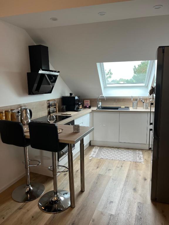 Kuchyňa alebo kuchynka v ubytovaní Loft ravissant avec parking gratuit
