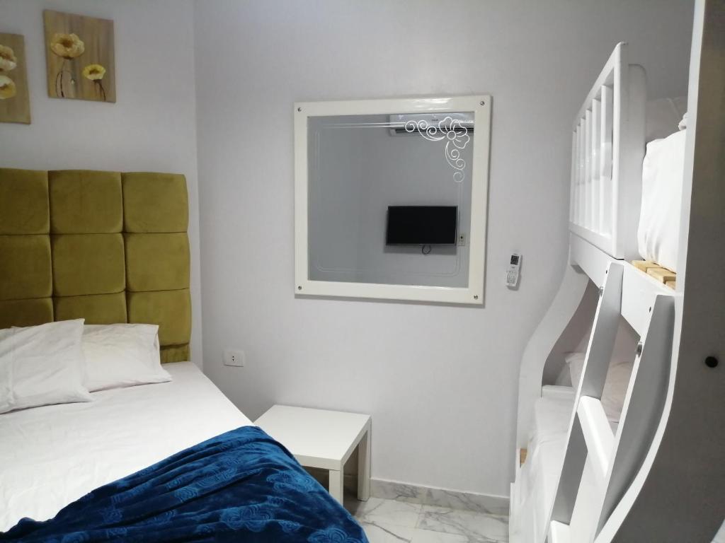 Ένα ή περισσότερα κρεβάτια σε δωμάτιο στο portosaid بورتوسعيد