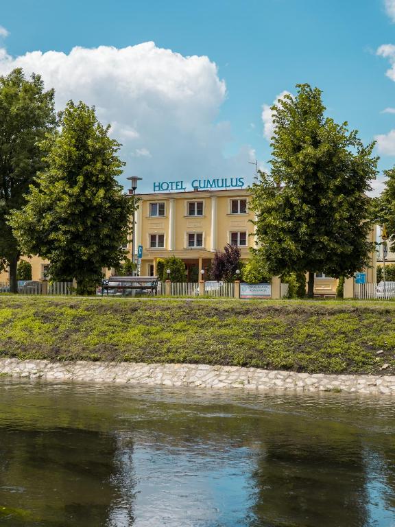 a hotel on the banks of a river at Cumulus Hotel in Będzin