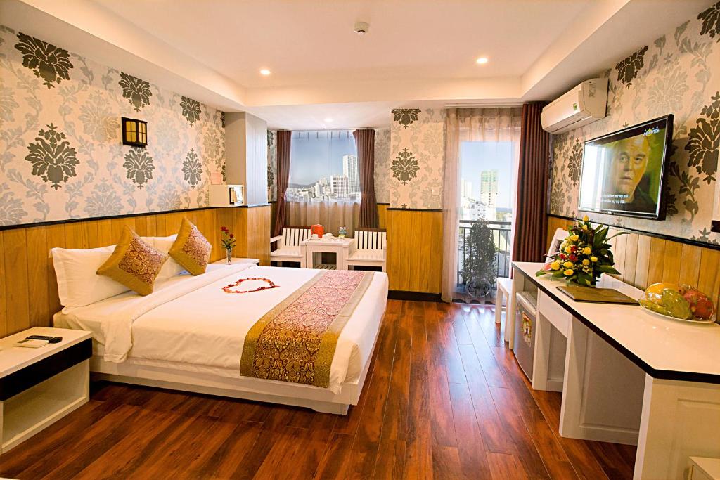 Postel nebo postele na pokoji v ubytování Golden Rain 2 Hotel