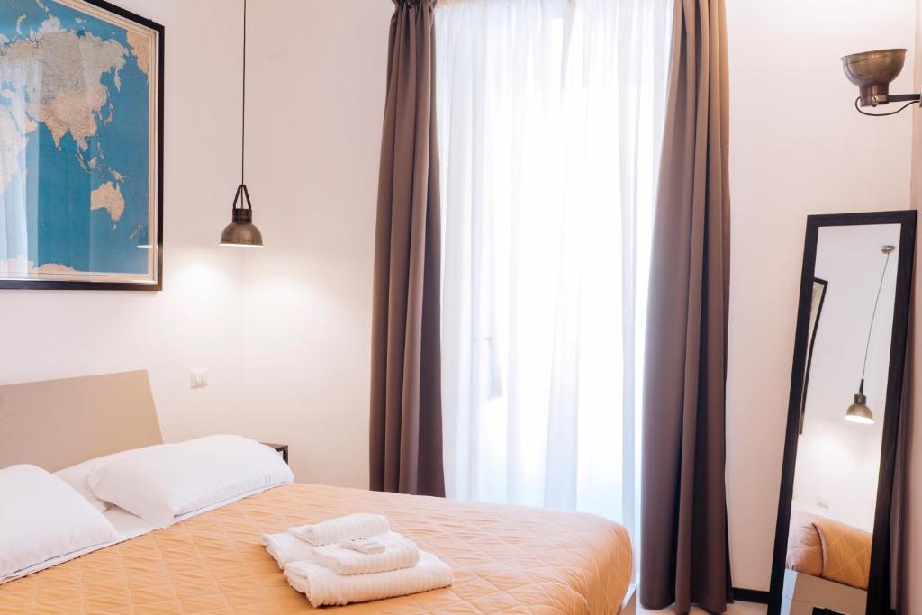 Posteľ alebo postele v izbe v ubytovaní Restart Accommodations Aldobrandini e Sciarra