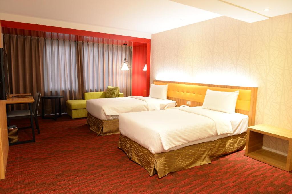 Postel nebo postele na pokoji v ubytování Bamboo Hotel