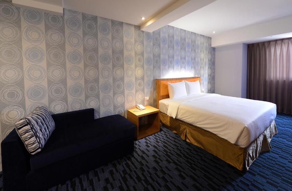 Postel nebo postele na pokoji v ubytování Bamboo Hotel