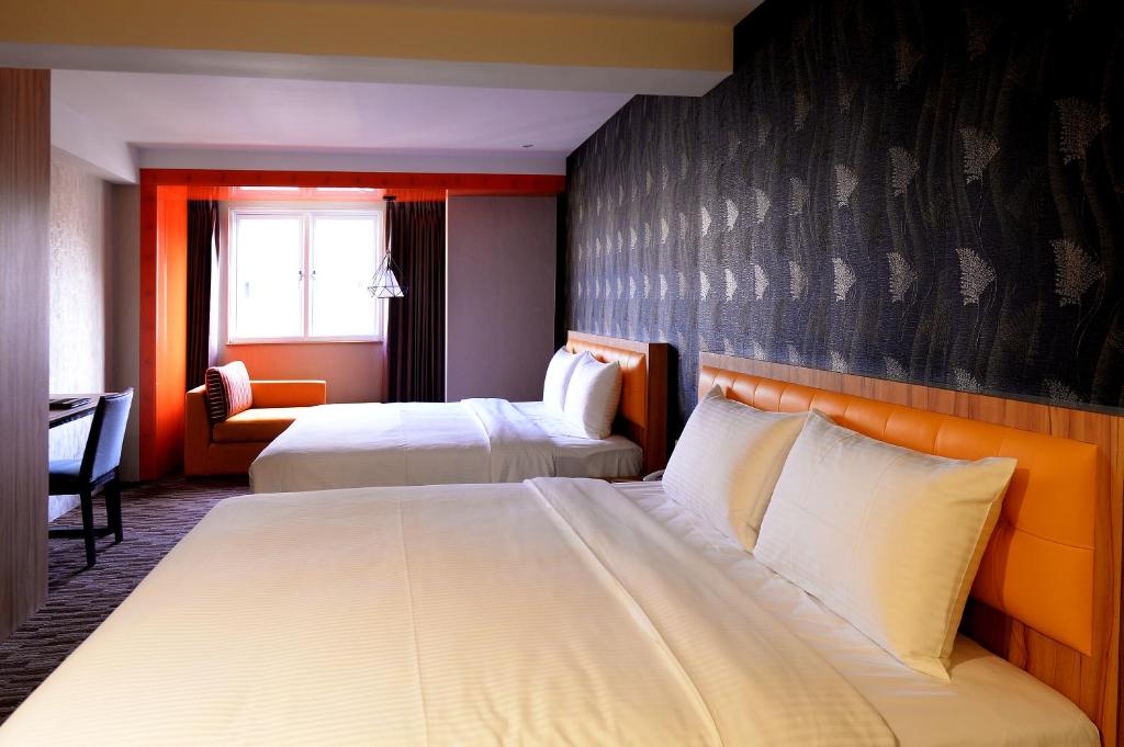 Postel nebo postele na pokoji v ubytování Bamboo Hotel