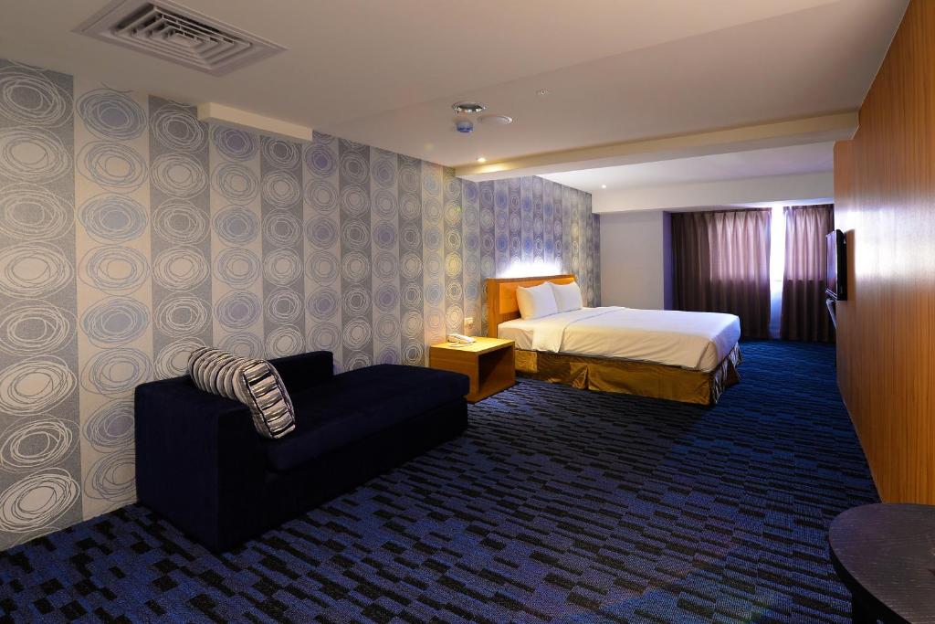 Postel nebo postele na pokoji v ubytování Bamboo Hotel