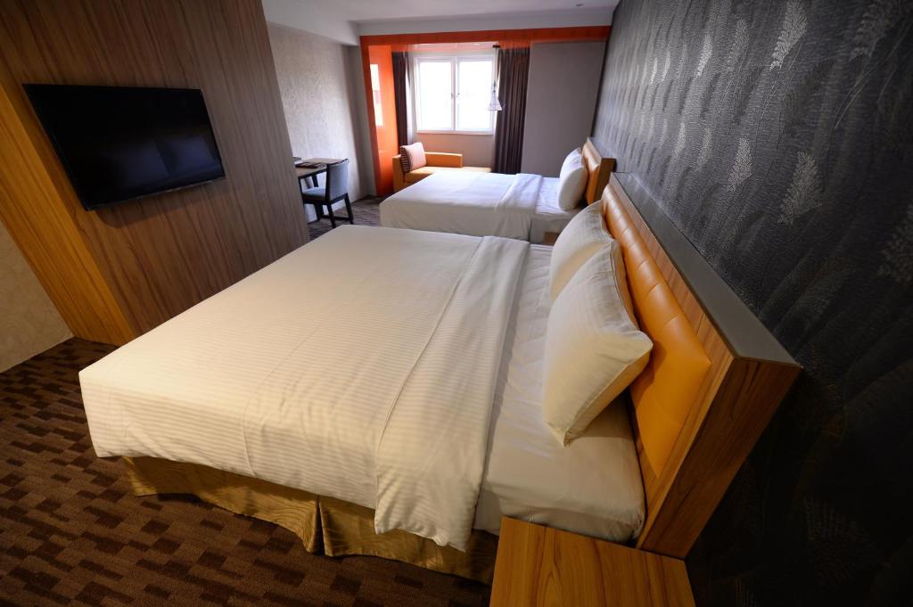 Postel nebo postele na pokoji v ubytování Bamboo Hotel