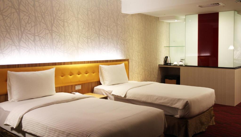 Postel nebo postele na pokoji v ubytování Bamboo Hotel
