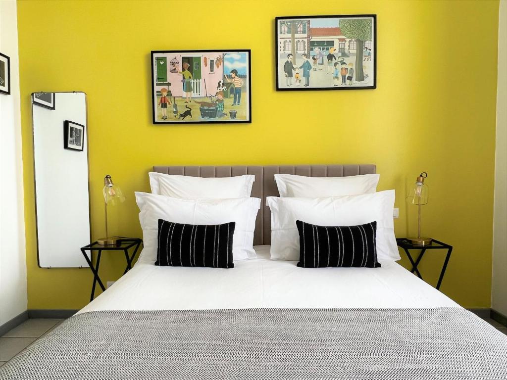 Postel nebo postele na pokoji v ubytování La Récréation - Chambres et Appartements