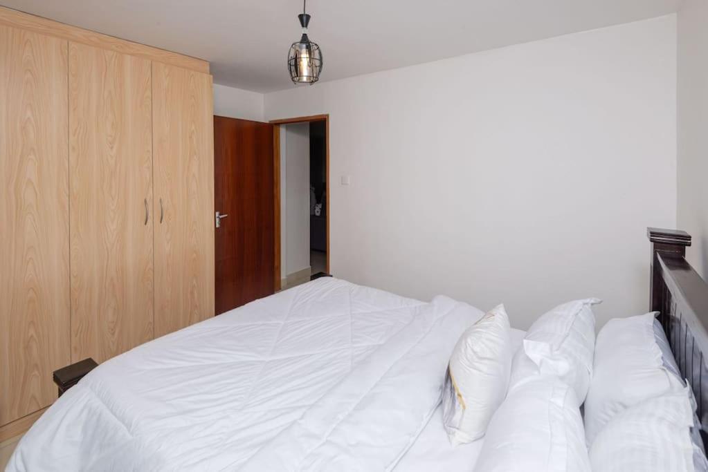 Postel nebo postele na pokoji v ubytování Athi Luxury Suites